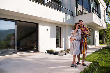 Image showing Young beautiful couple in bathrobes