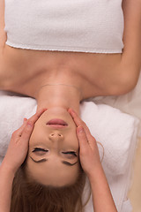 Image showing woman receiving a head massage