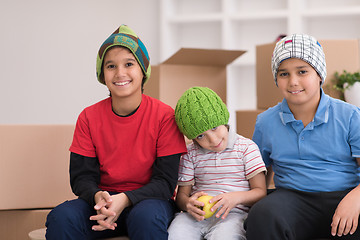 Image showing boys with cardboard boxes around them