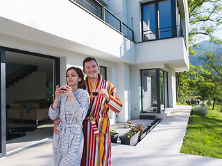 Image showing Young beautiful couple in bathrobes