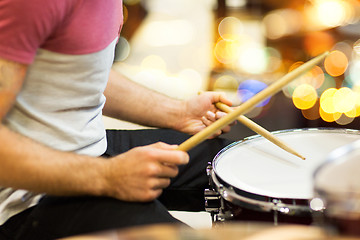 Image showing close up of musician or drummer playing drum kit