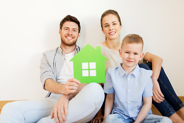 Image showing happy family with green house moving to new home