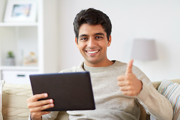 Image showing man with tablet pc showing thumbs up at home