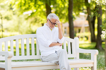 Image showing thoughtful senior man at summer park