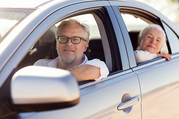 Image showing happy senior couple driving in car