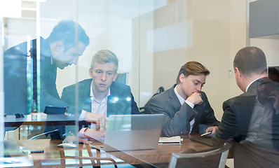 Image showing Business people sitting and brainstorming at corporate meeting.