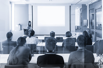 Image showing Woman giving presentation in lecture hall at university.