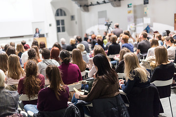 Image showing Woman giving presentation in lecture hall at university.