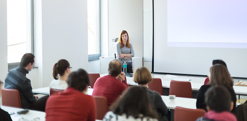 Image showing Woman giving presentation in lecture hall at university.