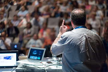 Image showing Public speaker giving talk at Business Event.