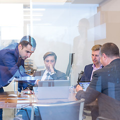 Image showing Business people sitting and brainstorming at corporate meeting.