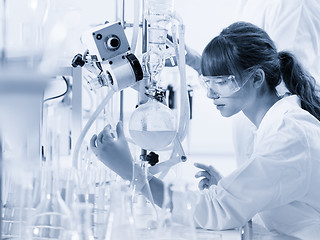 Image showing Young female chemists researching in life science laboratory.