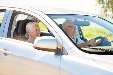 Image showing happy senior couple driving in car