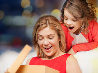 Image showing happy mother and daughter with gift box