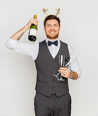 Image showing man with bottle of champagne at christmas party