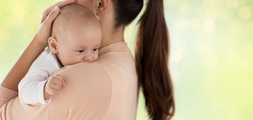 Image showing close up of little baby boy with mother