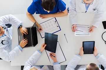 Image showing doctors with x-ray and cardiogram at hospital