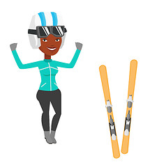 Image showing Cheerful skier standing with raised hands.