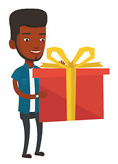 Image showing Joyful african-american man holding box with gift.