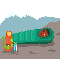 Image showing Woman resting in sleeping bag in the mountains.