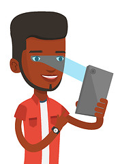 Image showing Man using iris scanner to unlock mobile phone.