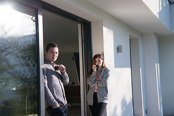 Image showing couple enjoying on the door of their luxury home villa