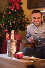 Image showing Happy young man with a glass of champagne