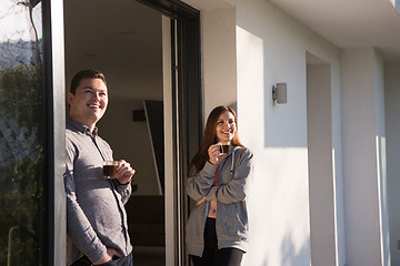 Image showing couple enjoying on the door of their luxury home villa