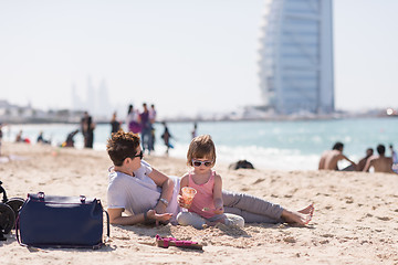 Image showing Mom and daughter on the beach