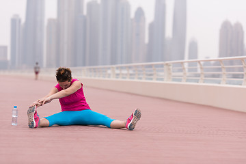 Image showing woman stretching and warming up