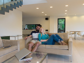 Image showing young happy couple relaxes in the living room