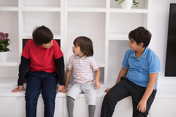 Image showing young boys posing on a shelf