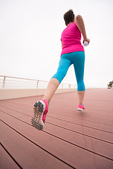 Image showing woman busy running on the promenade