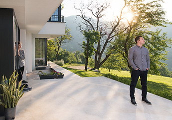 Image showing man in front of his luxury home villa