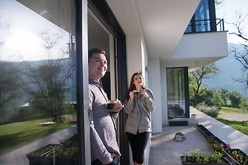 Image showing couple enjoying on the door of their luxury home villa