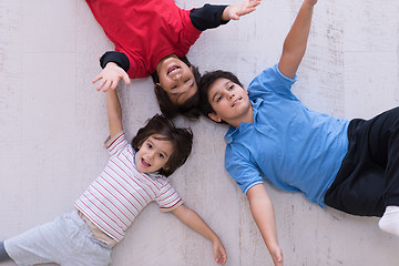 Image showing young boys having fun on the floor