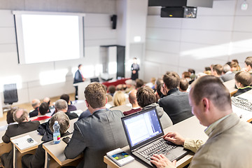 Image showing Business speaker giving a talk at business conference event.