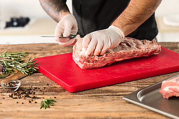 Image showing Man cooking meat steak on kitchen