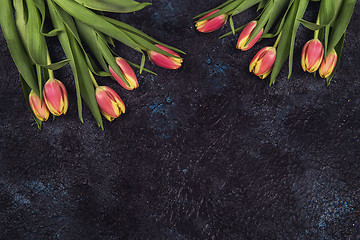 Image showing Tulips on darken concrete background