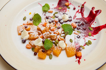 Image showing Tasty dessert from pumpkin and sea-buckthorn