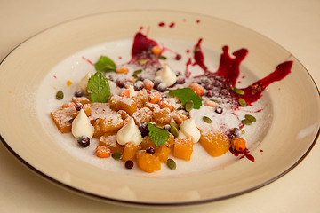 Image showing Tasty dessert from pumpkin and sea-buckthorn