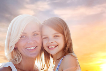 Image showing happy mother and daughter portrait over summer sky