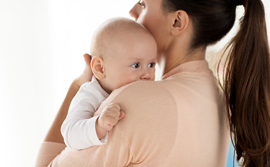 Image showing close up of little baby boy with mother