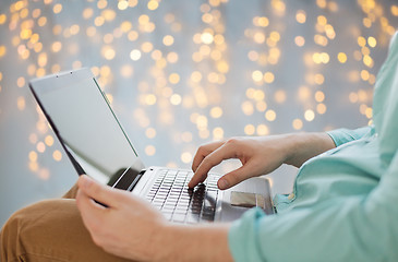 Image showing close up of man typing on laptop keyboard