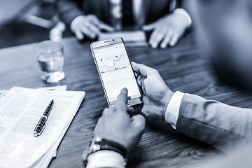 Image showing Close up of businessman using mobile smart phone.