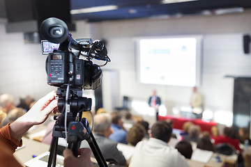 Image showing Television broadcasted press conference.