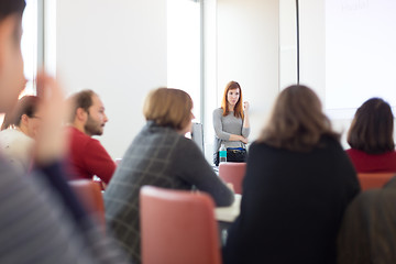 Image showing Woman giving presentation in lecture hall at university.