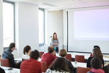 Image showing Woman giving presentation in lecture hall at university.