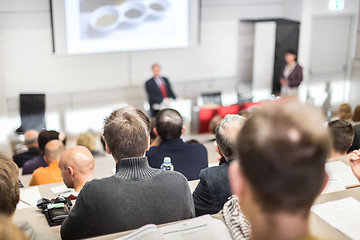 Image showing Business speaker giving a talk at business conference event.