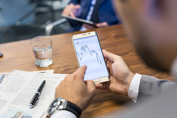 Image showing Close up of businessman using mobile smart phone.